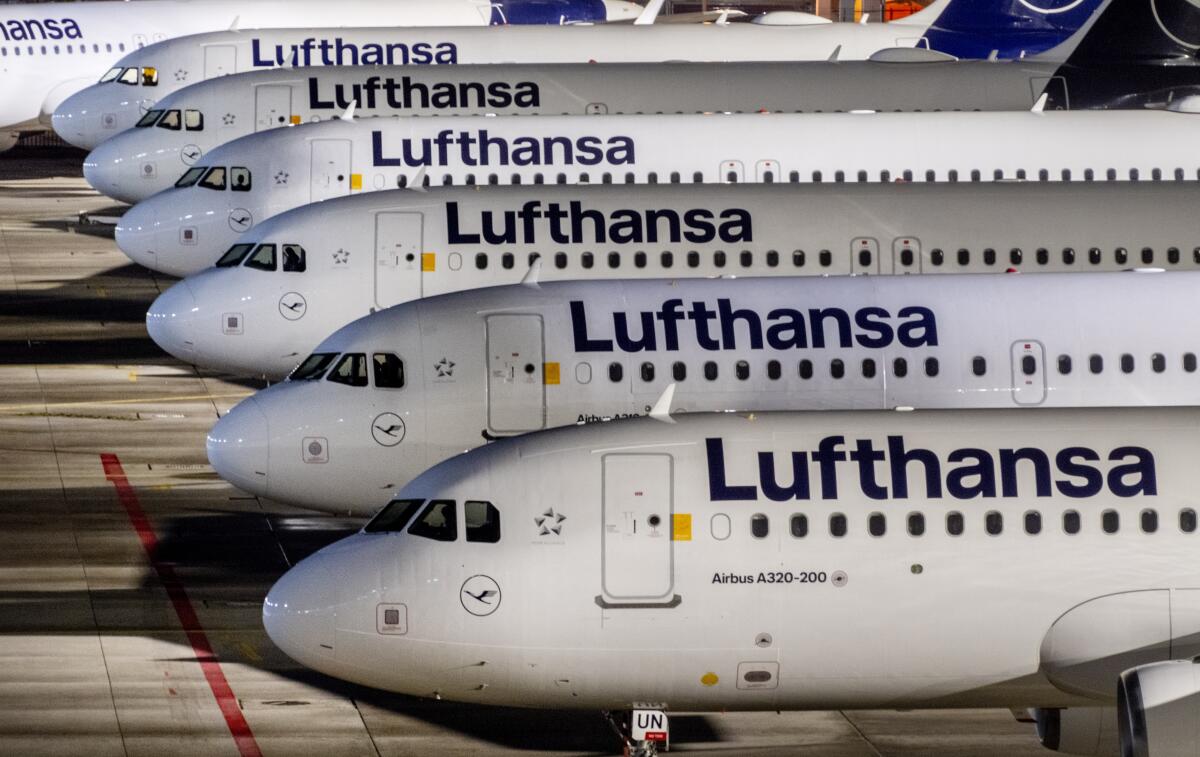 FILE - Lufthansa aircrafts are parked at the airport in Frankfurt, Germany, Wednesday, Feb. 7, 2024. A union has called on ground staff for Lufthansa at seven German airports to walk off the job for a day on Tuesday, following a similar strike earlier this month. The Ver.di union said Sunday that the strike will affect Frankfurt and Munich, Lufthansa's two main hubs, as well as Berlin, Duesseldorf, Hamburg, Cologne-Bonn and Stuttgart. (AP Photo/Michael Probst, File)