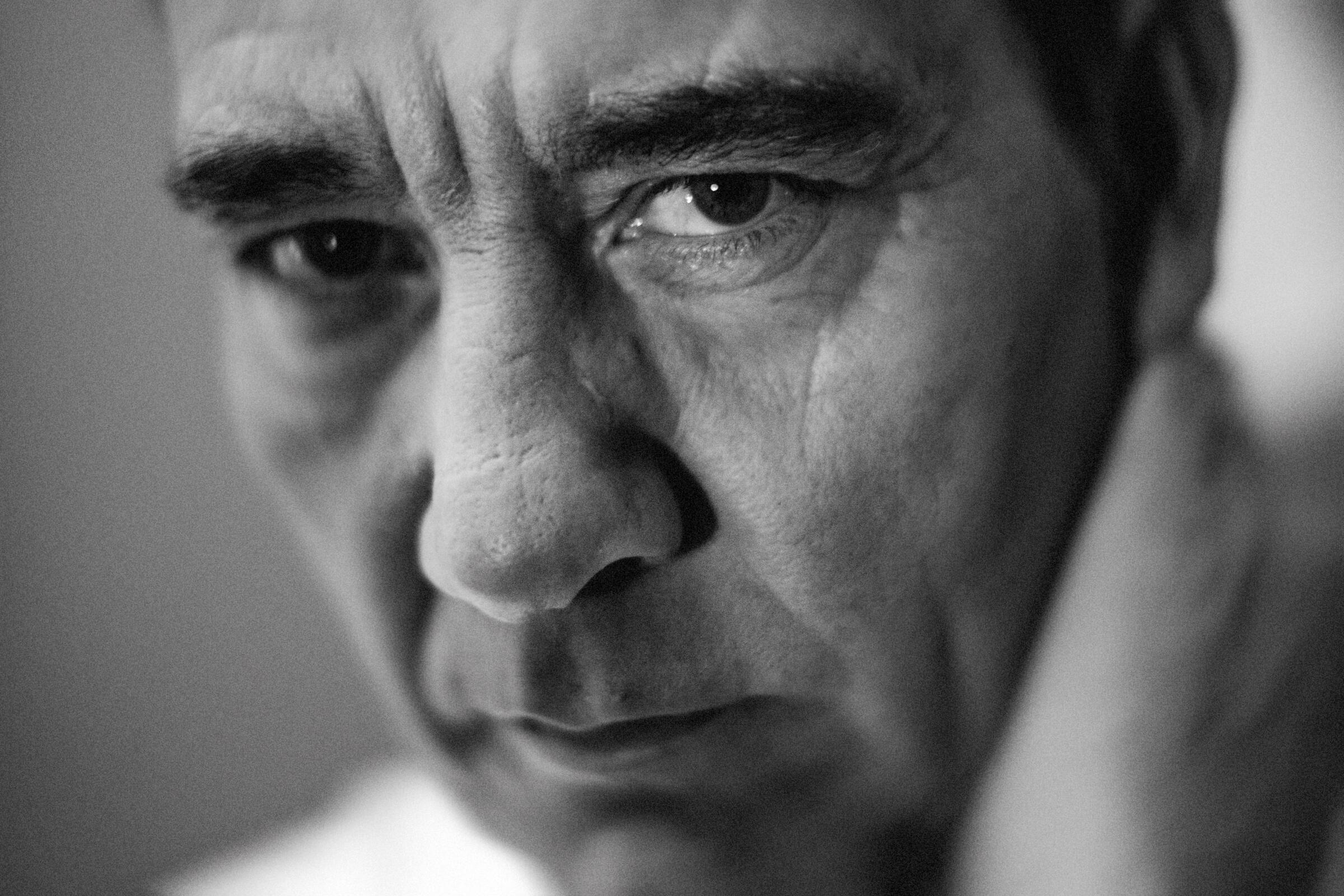 A closeup shot of Clive Owen, who is looking at the camera.