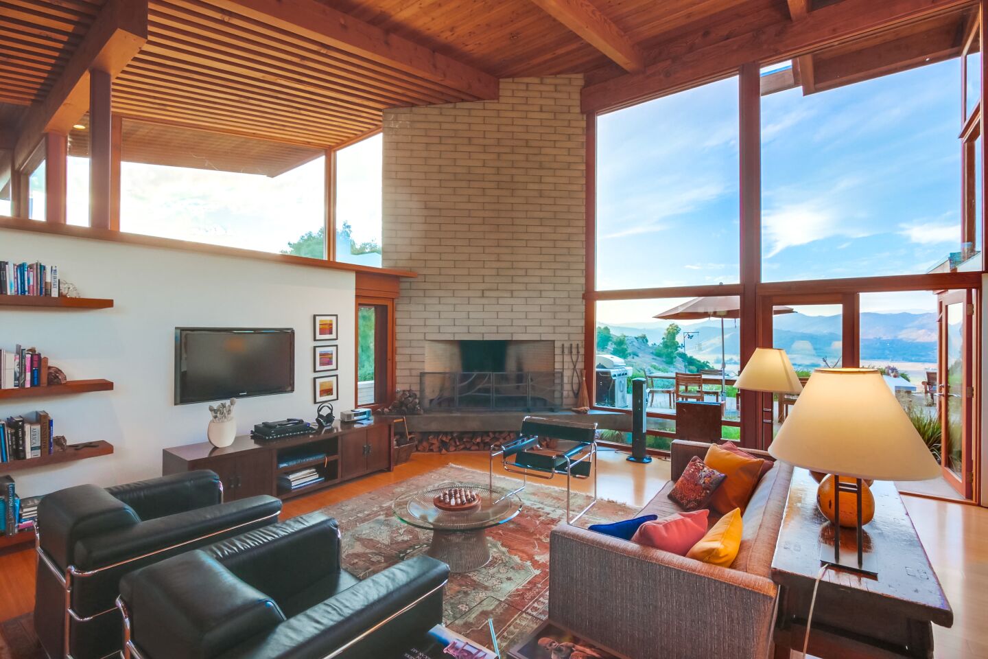 The living has a floor-to-ceiling fireplace.
