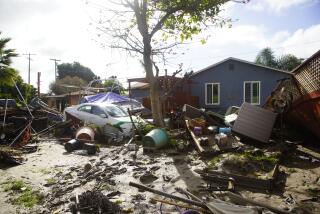 San Diego, California - January 23: Heavy rains flood five homes on Paradise Valley Road and 8th St. Residents deal with aftermath a day after the storm in National City on Tuesday, Jan. 23, 2024 in San Diego, California. (Alejandro Tamayo / The San Diego Union-Tribune)