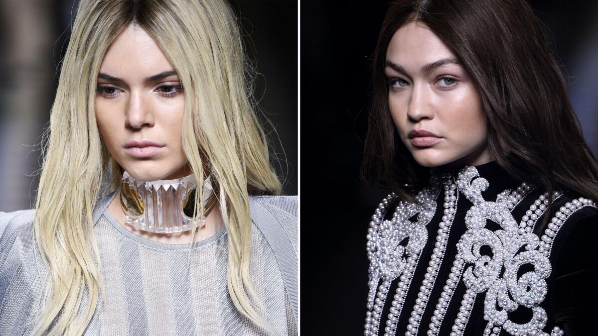 Kendall Jenner and Gigi Hadid at the Balmain 2016-2017 fall/winter ready-to-wear collection fashion show in Paris on March 3.