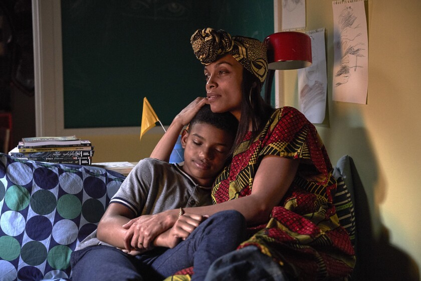 Lonnie Chavis is embraced by Rosario Dawson in "The Water Man."