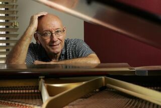 Jazz pianist Mike Wofford, at his San Diego home, has had a prolific and stellar career at the keyboard. (K.C. Alfred / Union-Tribune)