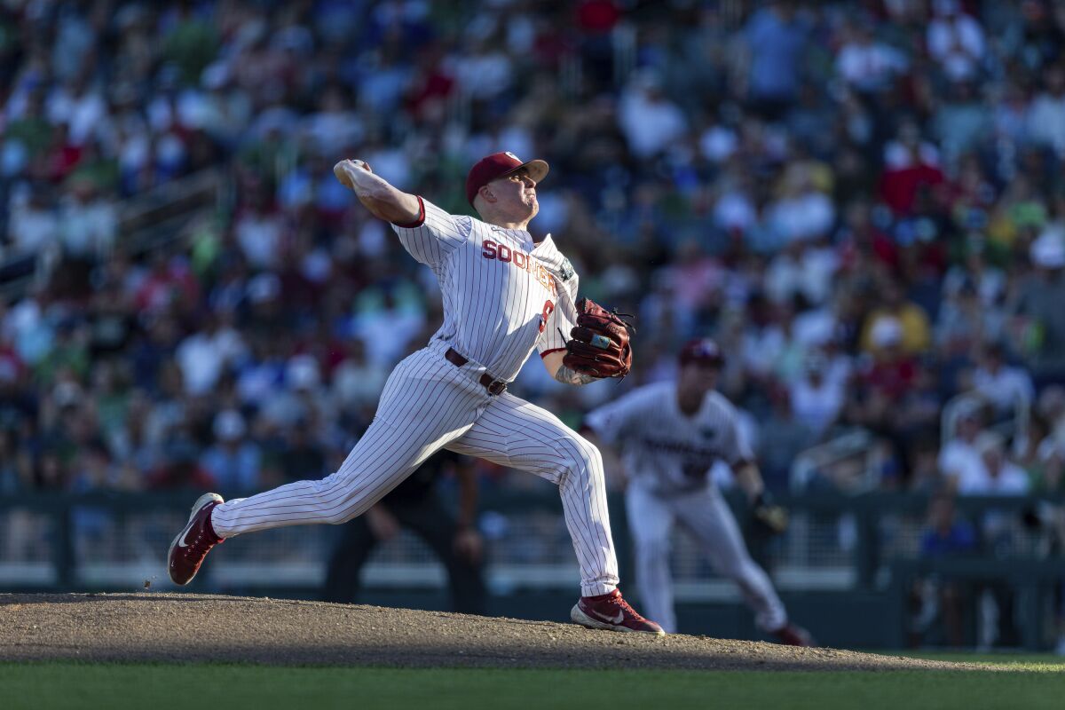 Oklahoma starting pitcher Cade Horton (9) throws a pitch in the second inning against Notre Dame during an NCAA College World Series baseball game, Sunday, June 19, 2022, in Omaha, Neb. (AP Photo/John Peterson)