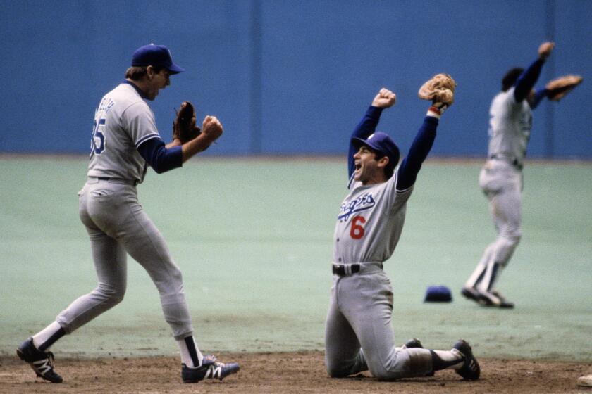 MONTREAL - OCTOBER 19: Steve Garvey #6 and pitcher Bob Welch #35 of the Los Angeles Dodgers celebrate after winning the National League Championship Series against the Montreal Expos at Olympic Stadium on October 19 1981 in Montreal, Quebec, Canada. (Photo by Ronald C. Modra/Sports Imagery/Getty Images) ** OUTS - ELSENT, FPG - OUTS * NM, PH, VA if sourced by CT, LA or MoD **