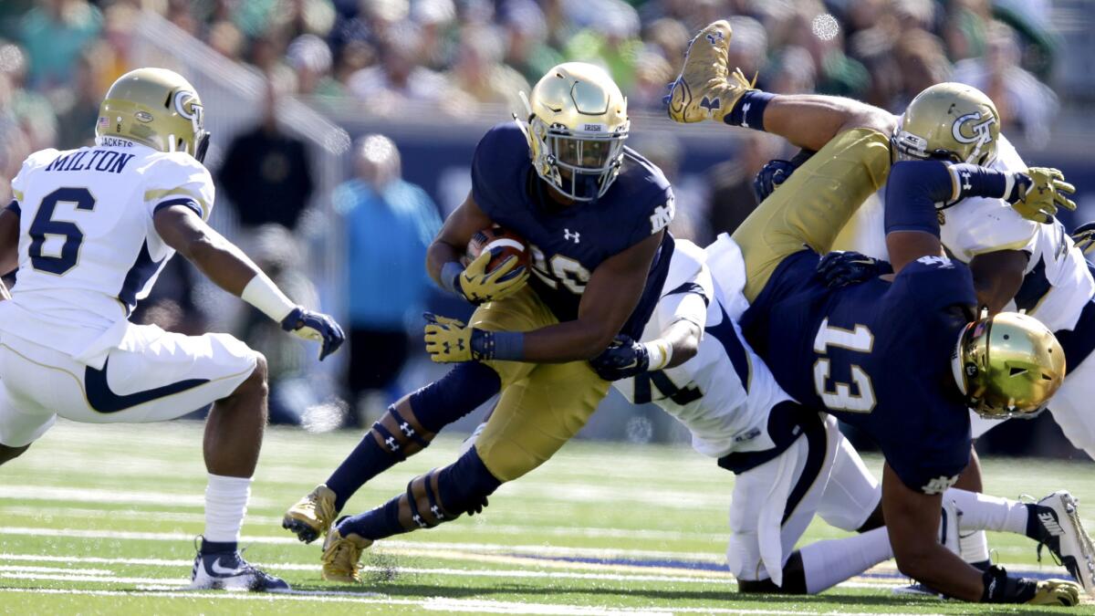 Notre Dame running back C.J. Prosise cuts upfield as Georgia Tech defensive back Chris Milton (6) is in pursuit in the first half Saturday.