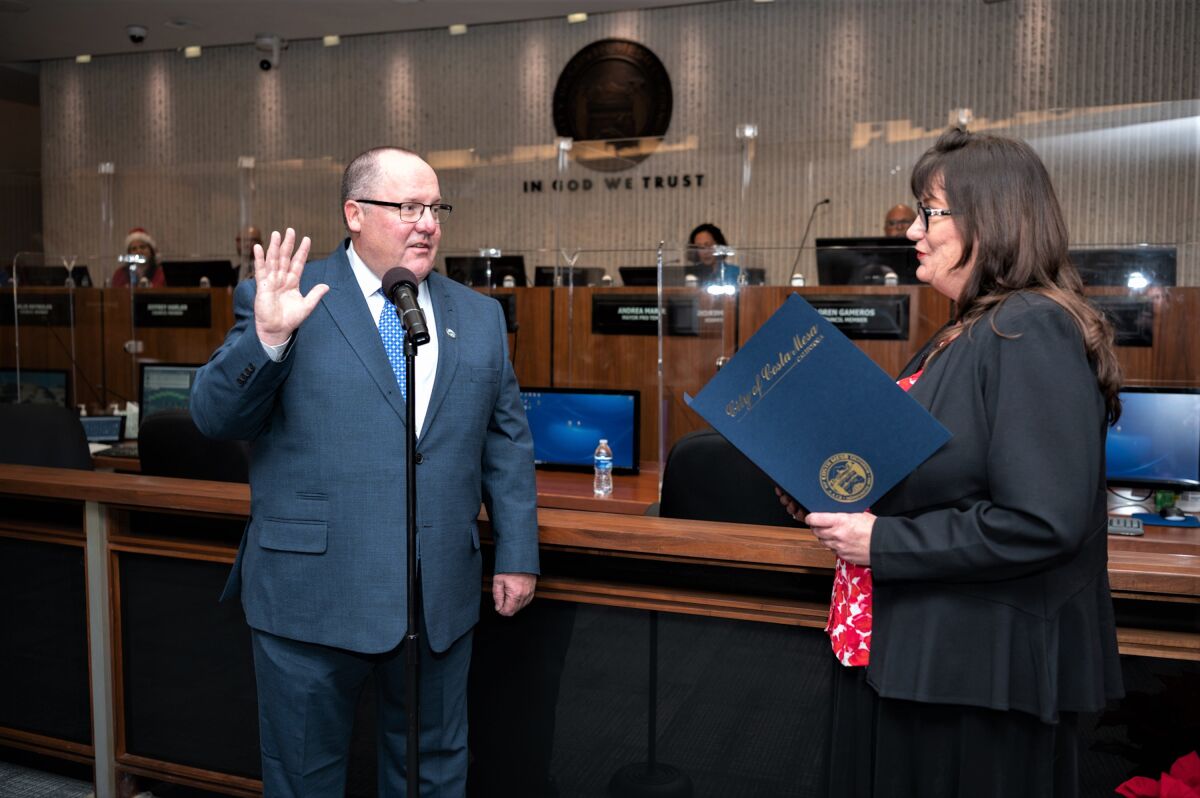 Costa Mesa Mayor John Stephens is sworn in to office Tuesday by City Clerk Brenda Green.