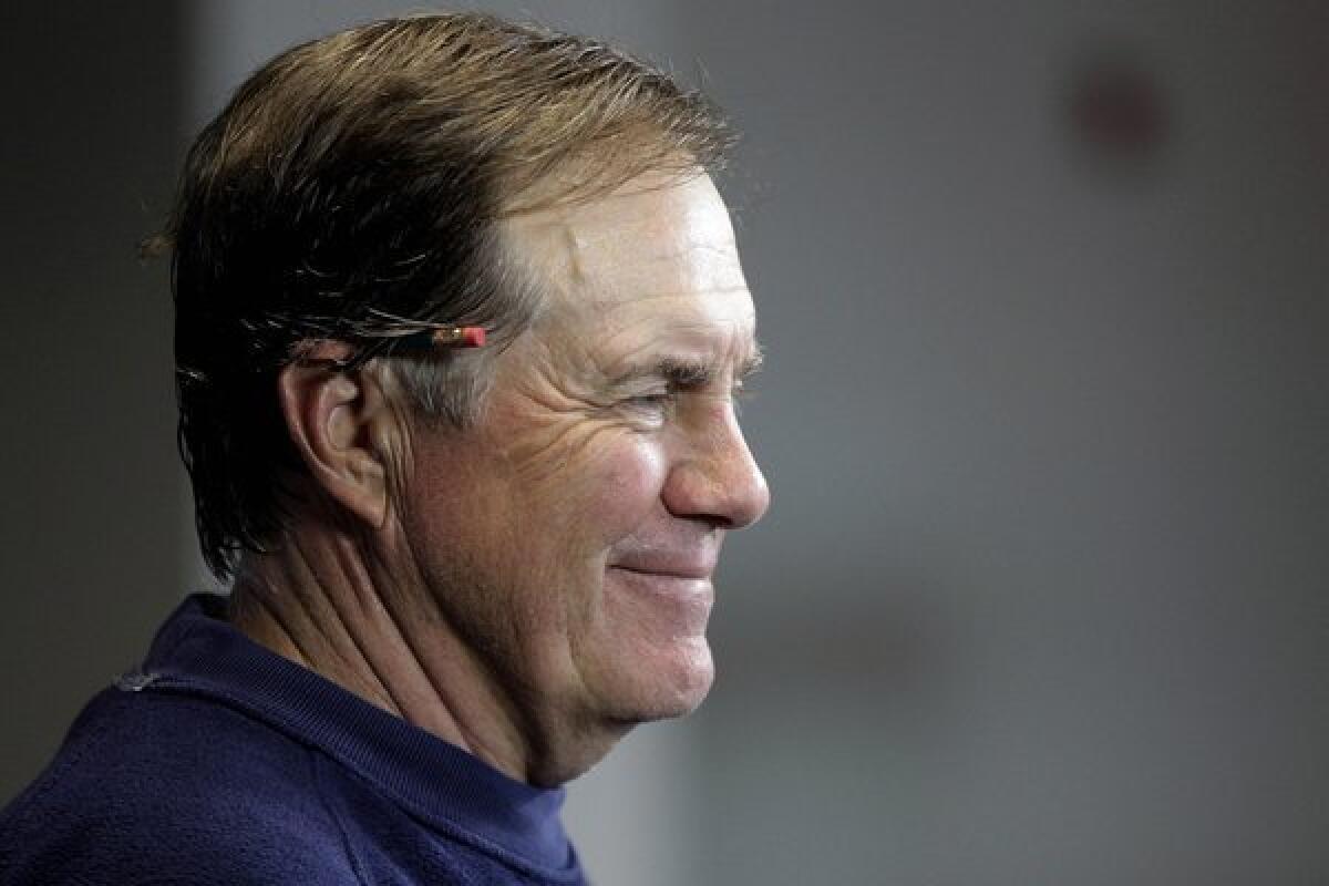 New England Coach Bill Belichick showed his lighter side while answering fans' questions on his girlfriend's Twitter account Tuesday night.