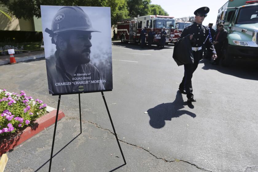 FILE - Firefighters arrive to attend a memorial for Charles Morton, the U.S. Forest Service firefighter assigned to the Big Bear Hotshots who was killed in the line of duty on Sept. 17 on the El Dorado Fire, Sept. 25, 2020 at The Rock Church in San Bernardino, Calif. A man whose family’s gender reveal ceremony in 2020 sparked a Southern California wildfire that killed the firefighter has pleaded guilty to involuntary manslaughter. Prosecutors announced the guilty plea on Friday, Feb. 9, 2024. (Terry Pierson/The Orange County Register via AP, file)