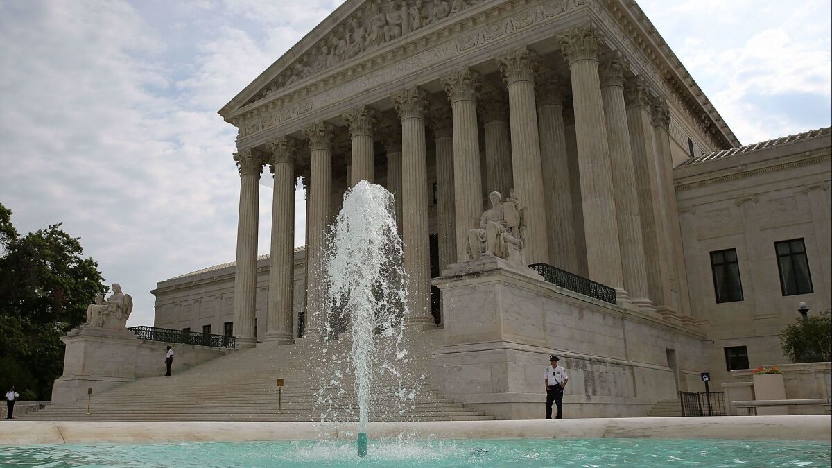 The U.S. Supreme Court in Washington. The justices wiped away lower court rulings that supported a young detained immigrant's right to obtain an abortion.