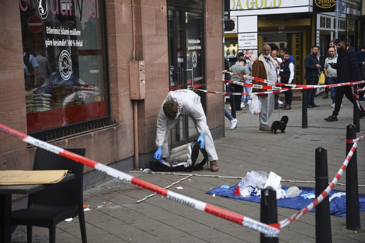 FILE --Forensics work at the scene where a man died after being stopped by police in Mannheim, Germany, Monday, May 2, 2022. Authorities in Germany are probing the death of a 47-year-old man who collapsed Monday during a police check in the city of Mannheim, prompting allegations of police violence after a video surfaced allegedly showing him being beaten by officers while lying on the ground. (Ren' Priebe/PR-Video/dpa via AP,file)