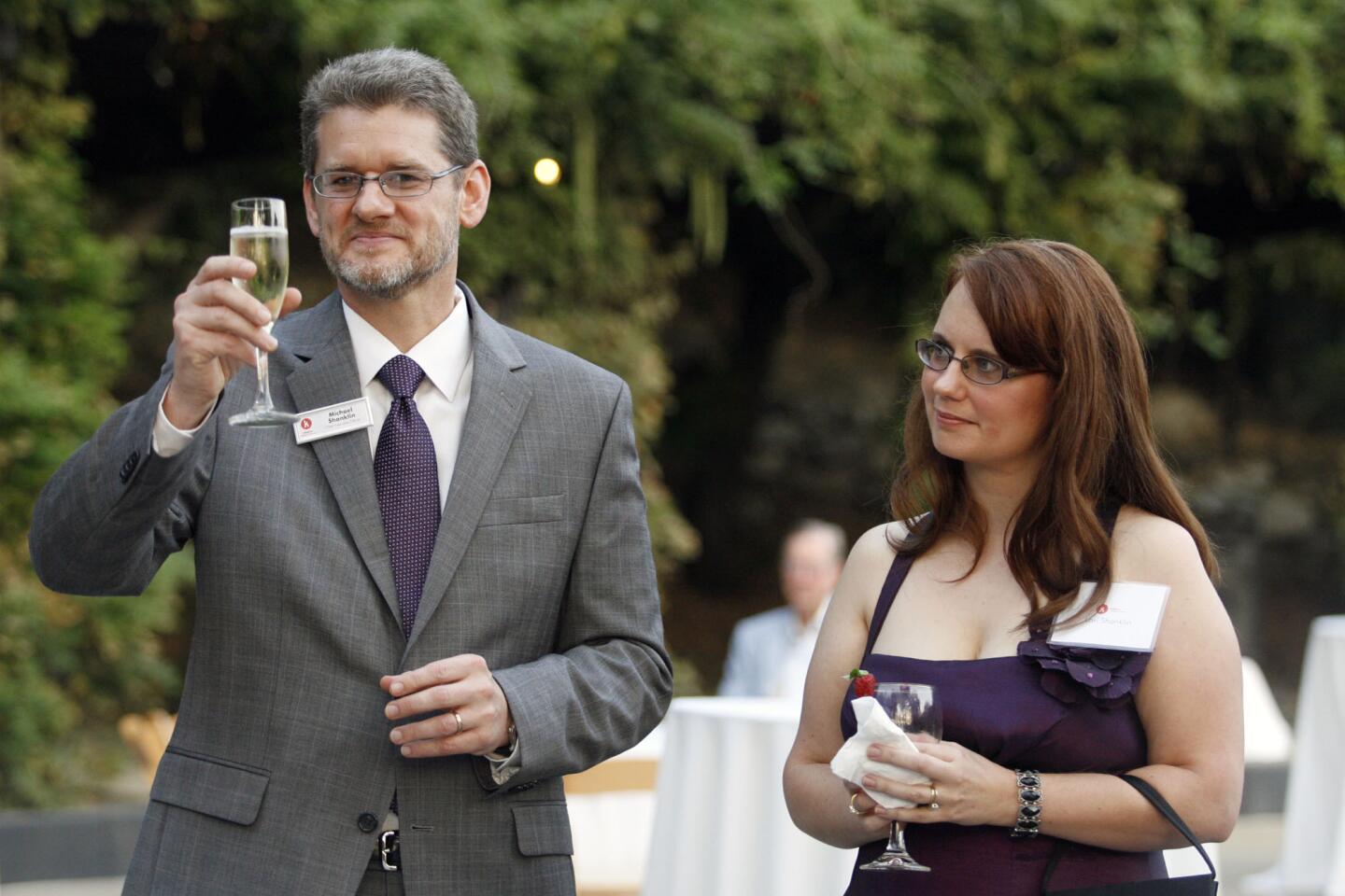 The new Chief Executive Officer for Kidspace Children's Museum, Michael Shanklin, left, and his wife, Lori, make a toast during his reception, which took place in Pasadena on Wednesday, September 14, 2011.