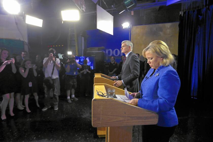 Democrat Mary Landrieu tried to distance herself from President Obama in her Senate runoff debate with Republican Bill Cassidy on Monday in Baton Rouge, La.