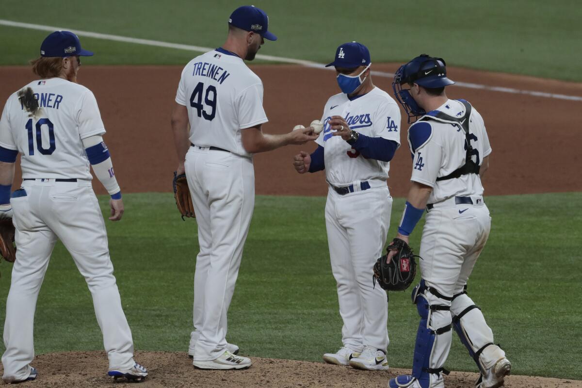 Dodgers manager Dave Roberts takes the ball pitcher Blake Treinen during Game 1 of the 2020 NLCS