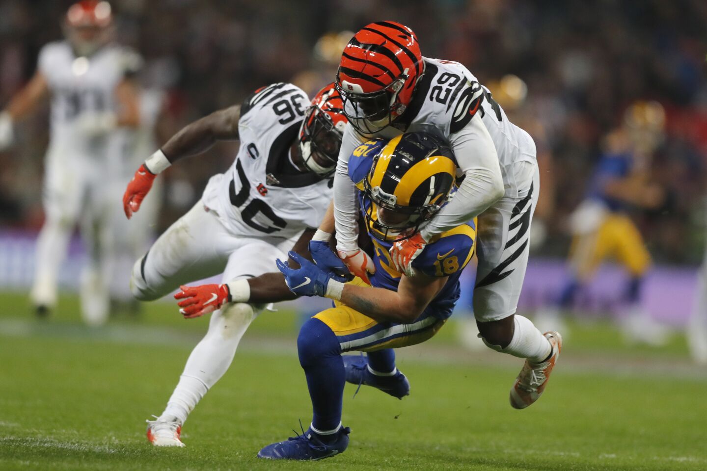 Rams wide receiver Cooper Kupp is tackled by Bengals cornerback Tony McRae (29) during the second half.