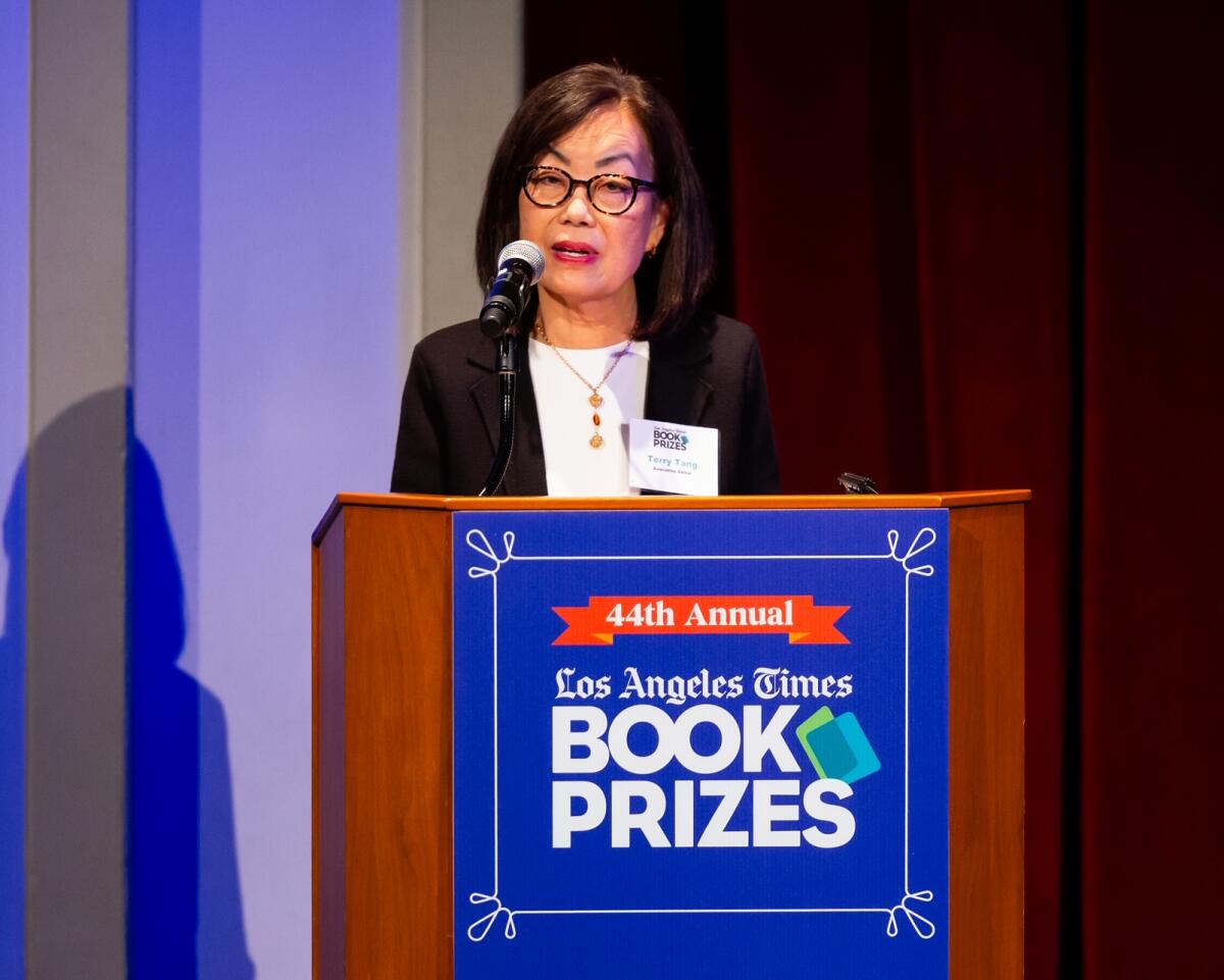 L.A. Times Executive Editor Terry Tang speaks from a lectern with the Los Angeles Times Book Prizes logo.