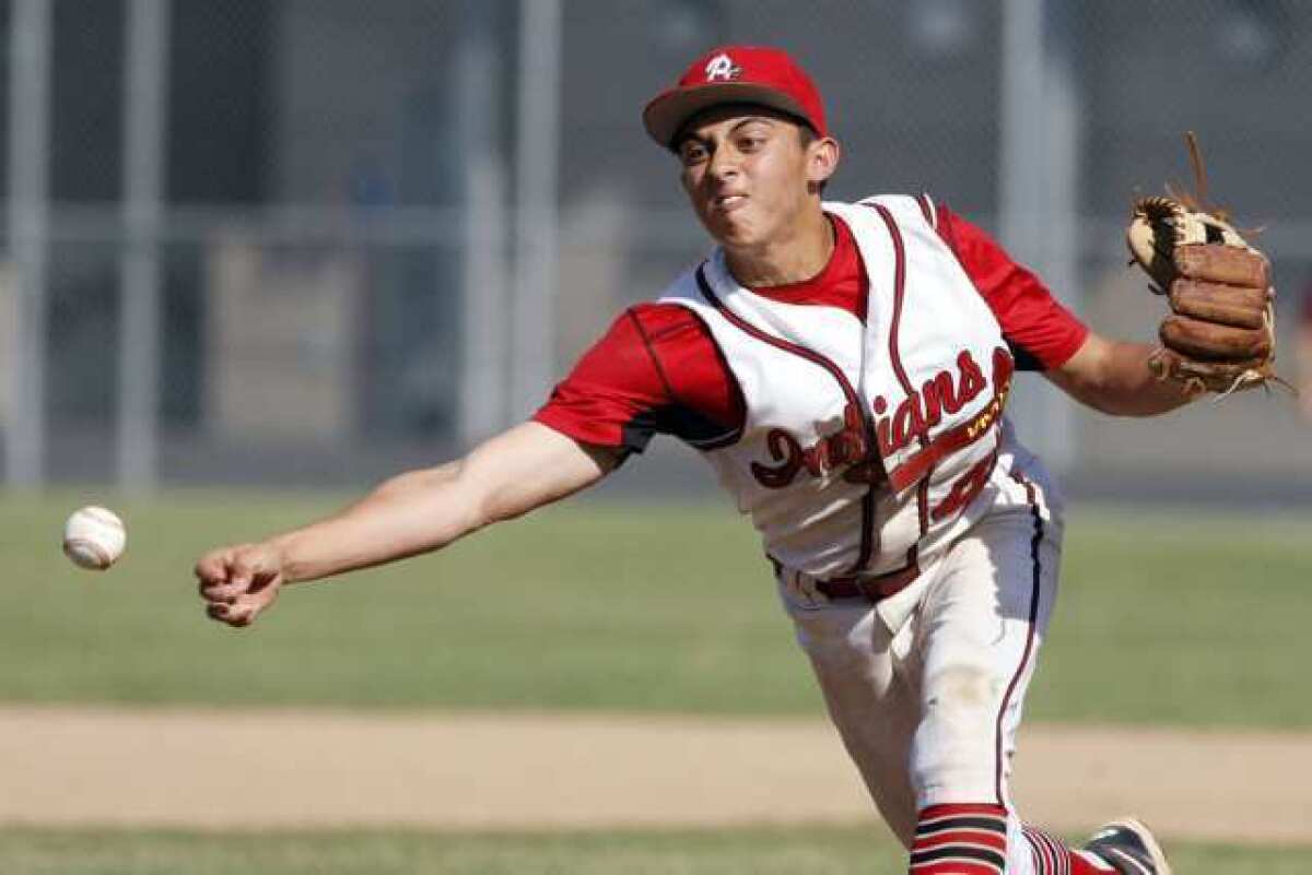 Burroughs' Miles Haddad pitches the ball during a game against Pasadena at John Burroughs High School in Burbank on Friday, April 26 2013.