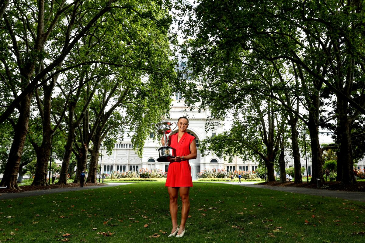 Ashleigh Barty holds the 2022 Australian Open winner's trophy