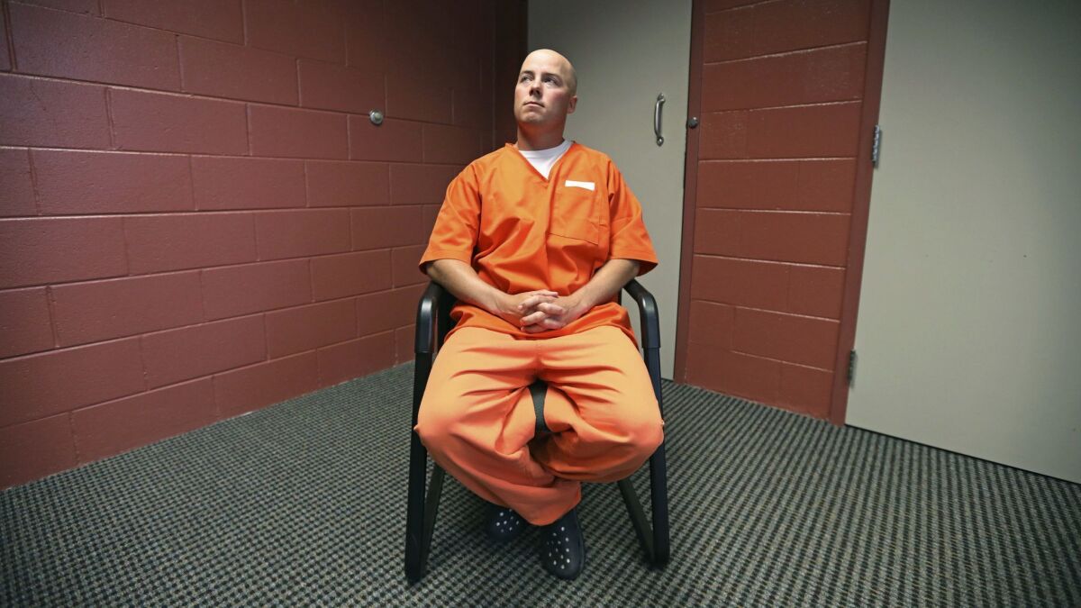 Inmate Russell Henderson looks on during a prison interview at Wyoming Medium Correctional Institution, in Torrington, Wyo. Henderson is serving two consecutive life sentences for the murder of Matthew Shepard in 1998.