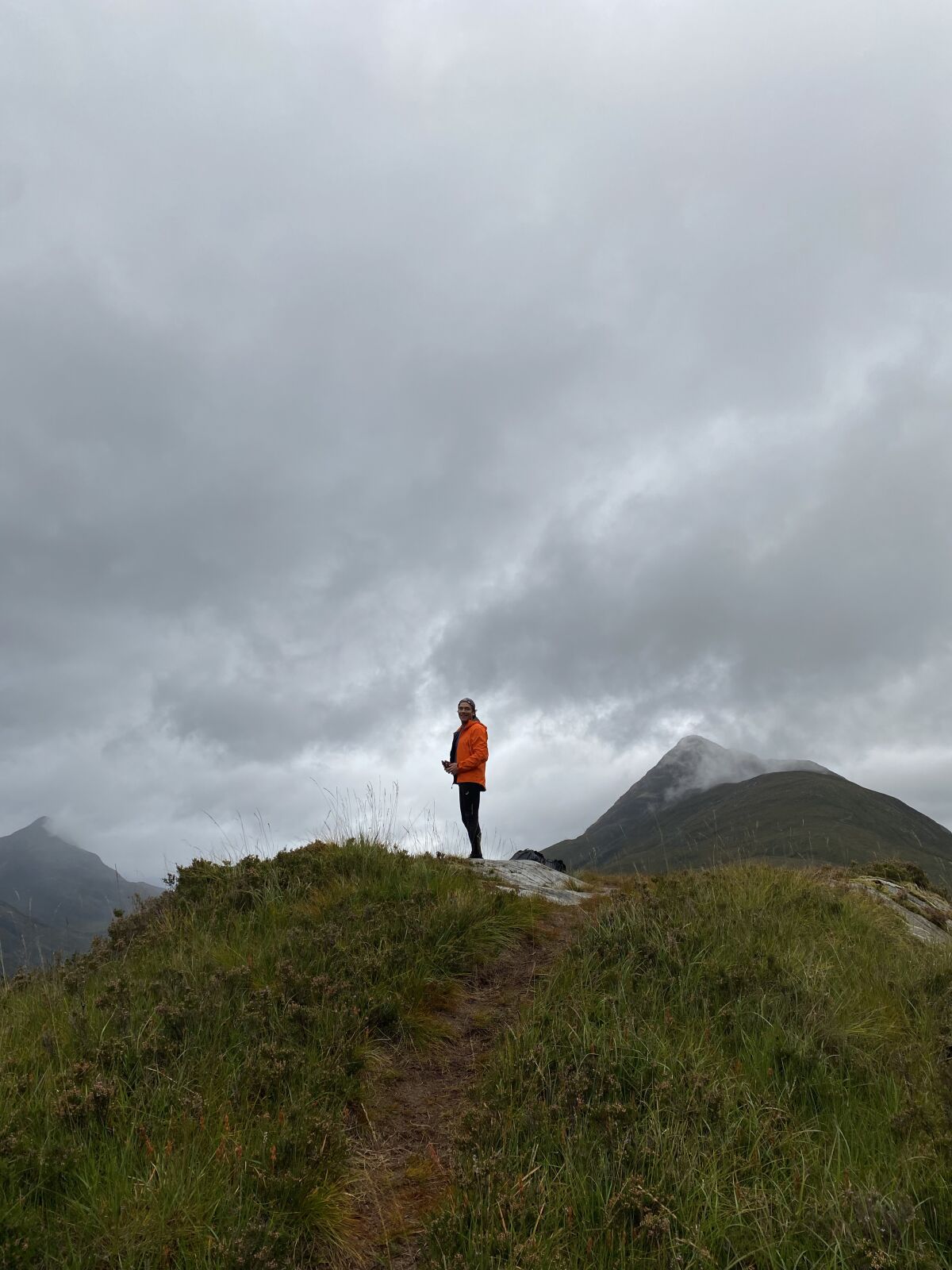 A man stands on a ridge in Scotland