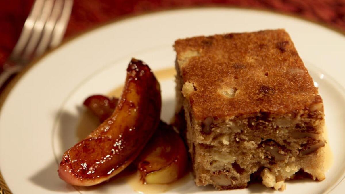 Apple date honey cake with sweet sesame sauce and sauteed apples. Recipe