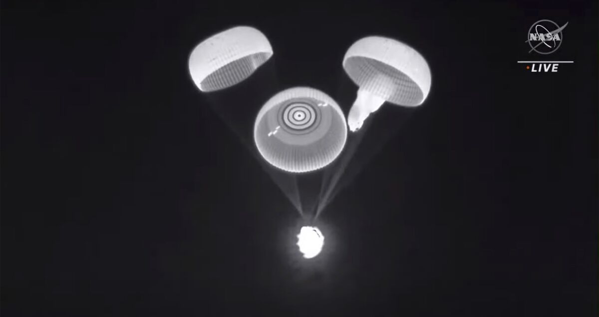 This image provided by NASA shows three of the four parachutes deploying on a cargo ship returning on Jan. 24, 2022. SpaceX and NASA are investigating a parachute issue that occurred on the last two capsule flights. One of the four main parachutes was slow to inflate during the return of four astronauts to Earth last November. The same thing happened last week as another Dragon capsule was bringing back science experiments. In both cases, the sluggish parachute eventually opened and inflated _ although more than a minute late _ and the capsules splashed down safely. (NASA via AP)