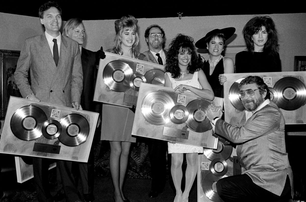 Walter Yetnikoff presents the Bangles with gold records.