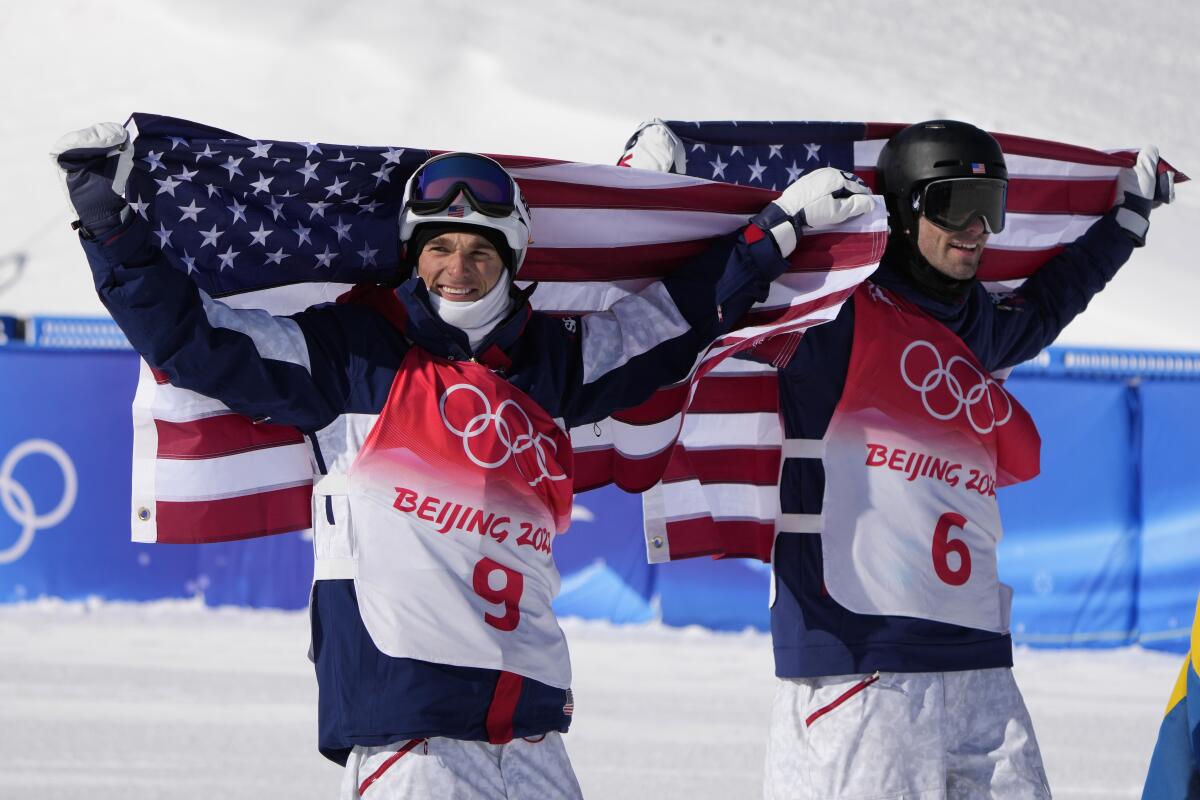 Nick Goepper and Alexander Hall celebrate after skiing at the 2022 Olympics.