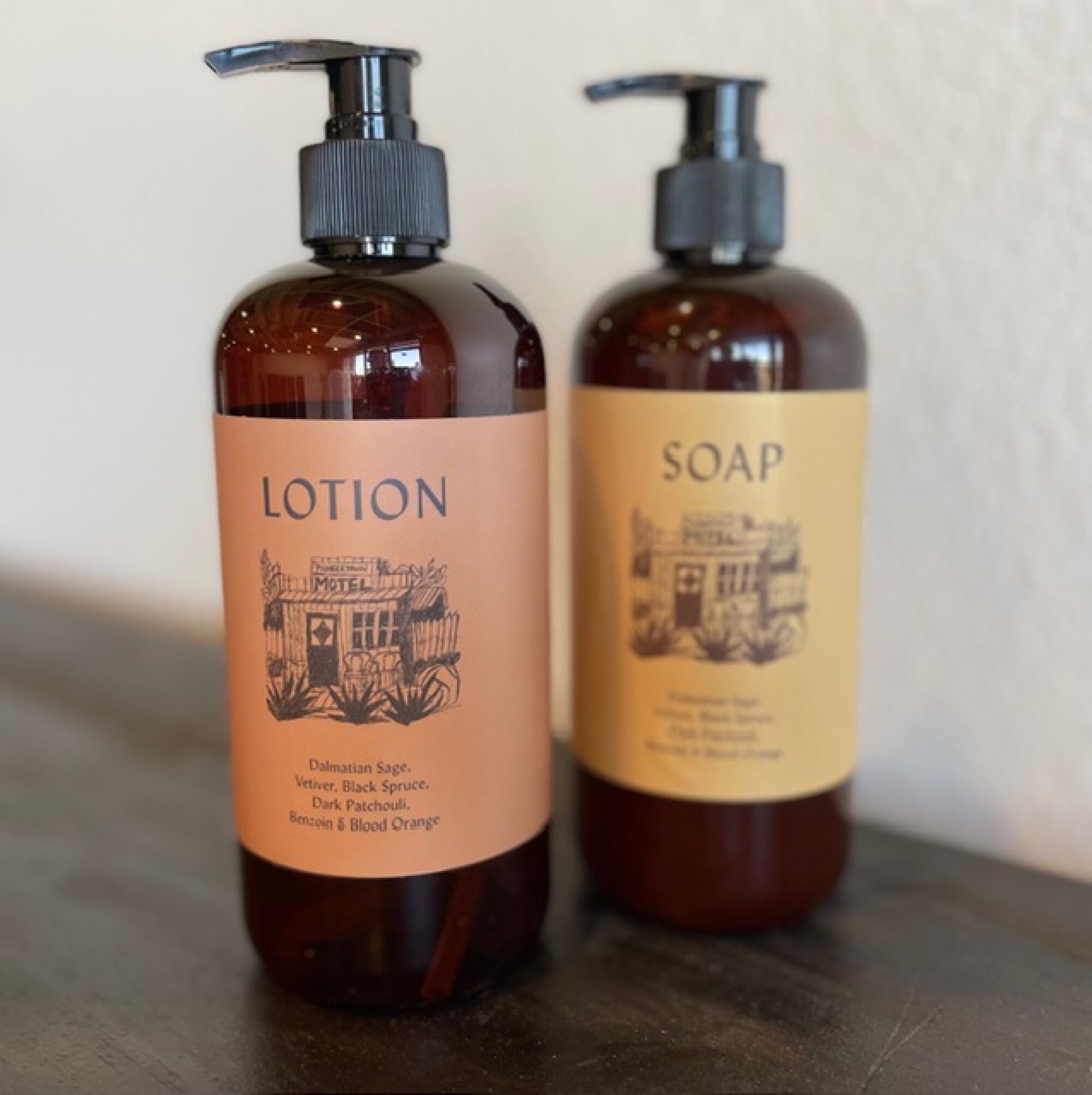 Two amber bottles of lotion and soap from Pioneertown Motel