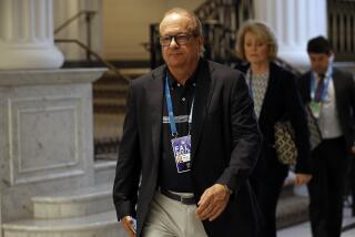 Dean Spanos, owner of the Los Angeles Chargers, leaves the NFL football owners meeting.