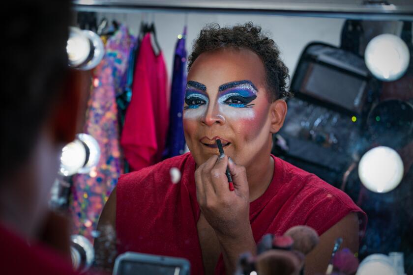 Del Mar, CA - June 10: At the Annual LGBTQ Celebration at the San Diego Fair on Saturday, June 10, 2023 in Del Mar, CA., Santio Cupon applies her makeup where she becomes drag queen, Landa Plenty for the story time. (Nelvin C. Cepeda / The San Diego Union-Tribune)