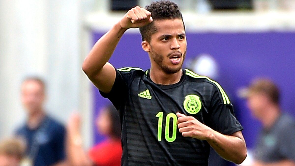 Mexico midfielder Giovani Dos Santos celebrates after scoring a goal during the second half of an exhibition against Costa Rica on June 27