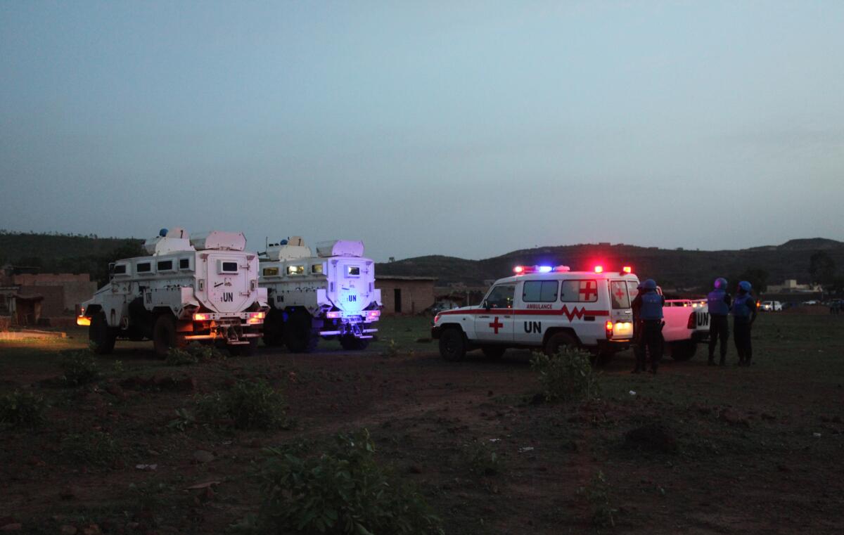 FILE - United Nations armored personnel vehicles are stationed with an ambulance outside a tourist resort near Bamako, Mali, June 18, 2017. The United Nations mission in Mali said Friday July 15, 2022 that Egypt will suspend its participation in the peacekeeping force in the West African country by mid-August citing deadly attacks against its troops. Seven Egyptian peacekeepers have been killed in Mali so far this year. (AP Photo/Baba Ahmed, File)