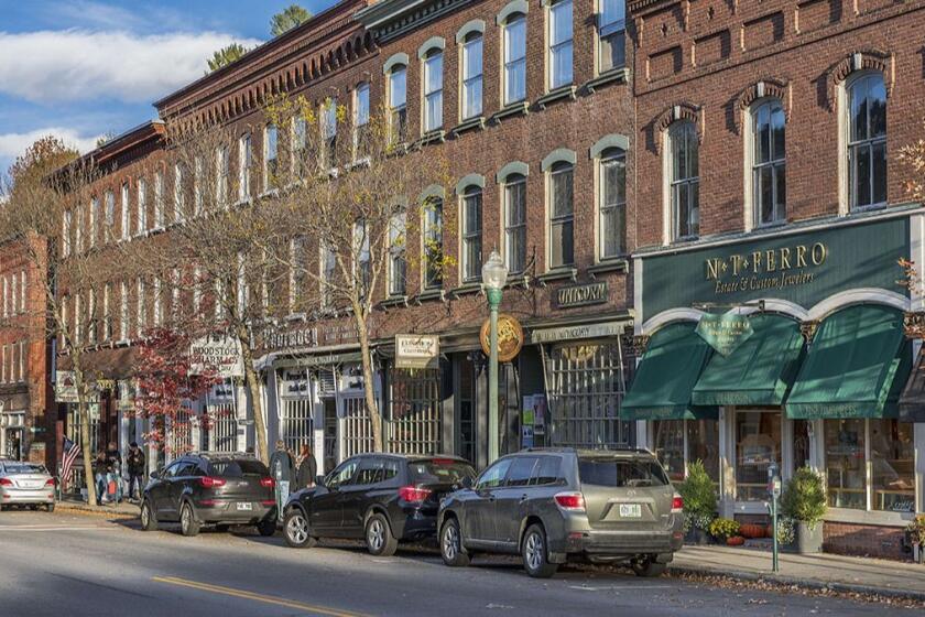 VILLAGE OF WOODSTOCK, WOODSTOCK, VERMONT, UNITED STATES - 2015/10/14: Main Street shops. (Photo by John Greim/LightRocket via Getty Images)