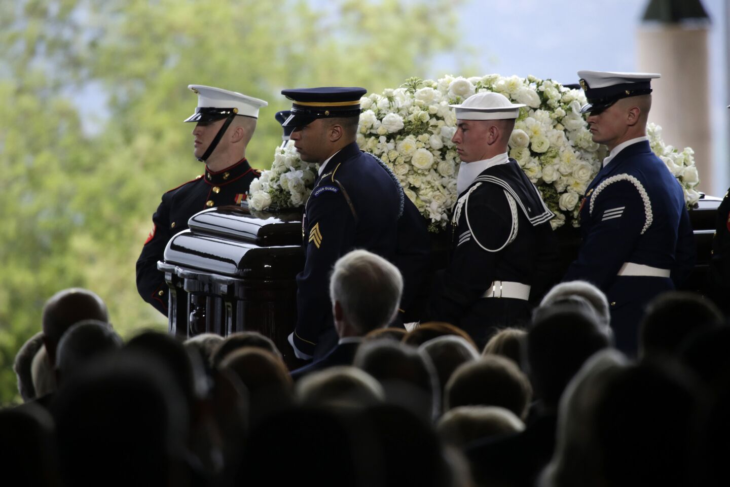 A military honor guard carries Nancy Reagan's casket to her gravesite at the Ronald Reagan Presidential Library in Simi Valley.