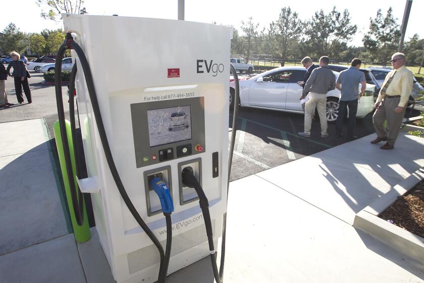 David Webb, director of Newport Beach Public Works, looks at the new EV go charging station at the Newport Coast Community Center on Tuesday. Newport Beach celebrated 20 new charging stations around the city.