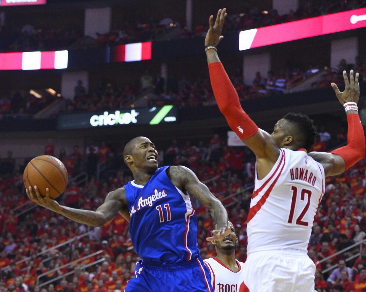 Clippers guard Jamal Crawford drives to the basket againt Rockets center Dwight Howard during Game 7.