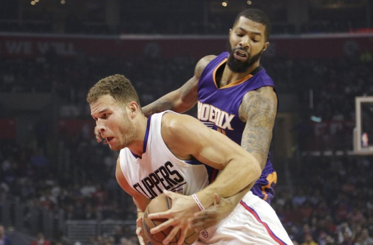 Clippers forward Blake Griffin works past Suns forward Markieff Morris during the first half of the game at Staples Center on Nov. 2.