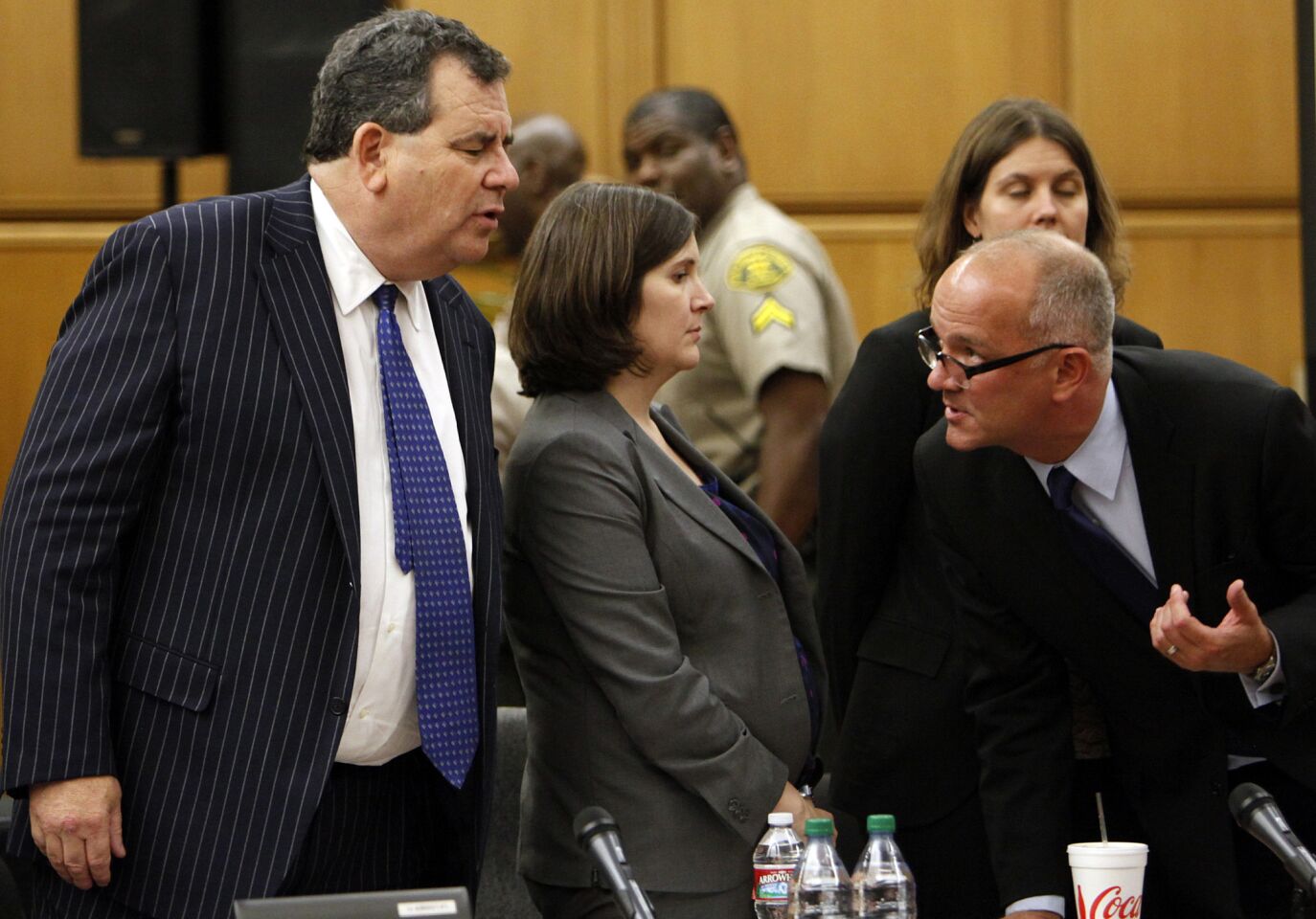 Brian Panish, left, attorney for the Michael Jackson family, speaks with Kathryn Cahan and Marvin Putnam, attorneys with AEG Live LLC ,in Los Angeles County Superior Court in the Michael Jackson wrongful-death trial Thursday in downtown Los Angeles.