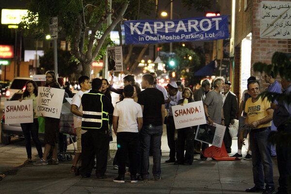 Demonstrators outside the Ohel Moshe synagogue on Pico Boulevard in Los Angeles protest the ritual killing of chickens.