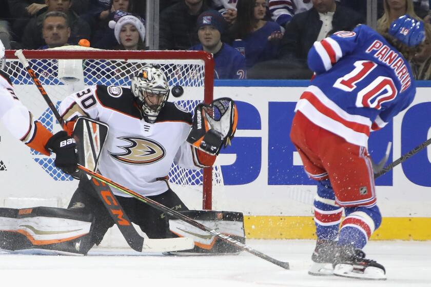 NEW YORK, NEW YORK - DECEMBER 22: Ryan Miller #30 of the Anaheim Ducks makes the third period save on Artemi Panarin #10 of the New York Rangers at Madison Square Garden on December 22, 2019 in New York City. The Rangers defeated the Ducks 5-1. (Photo by Bruce Bennett/Getty Images)