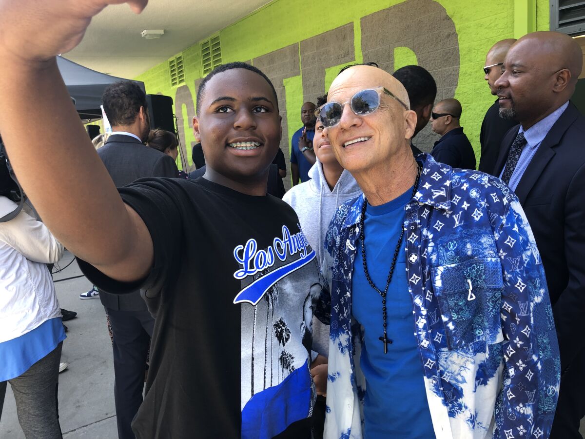 Ninth-grader Jaylen Bell takes a selfie with Jimmy Iovine.