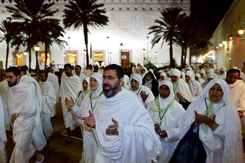 Imam Qazwini leads his pilgrim group out of the Al Shajara mosque outside Medina. The group has just performed a mass declaration of intent to perform the Hajj -- the final step before traveling to Mecca.