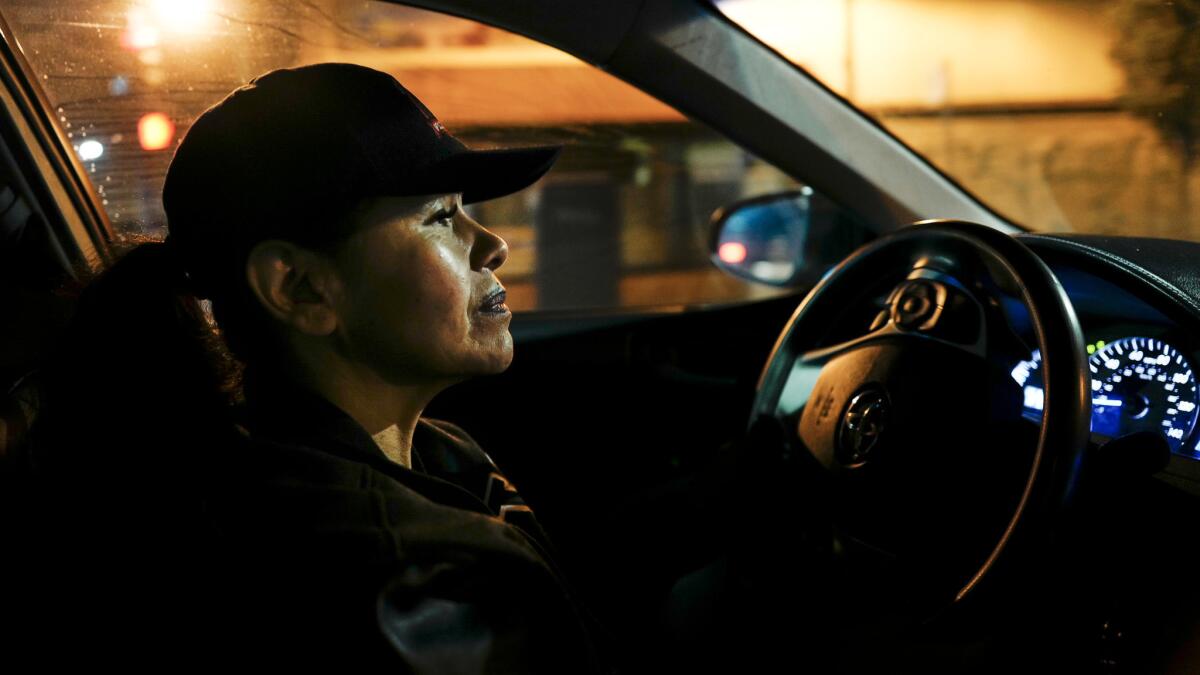 Silvia Vigil drives down International Boulevard in Oakland, looking for women she thinks are prostitutes.