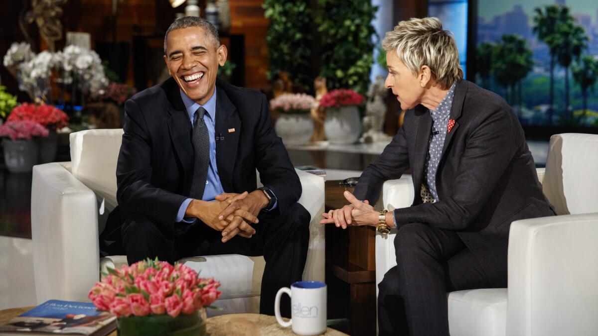 President Obama talks with Ellen DeGeneres on Thursday during a break in taping her show. The appearance would air Friday.