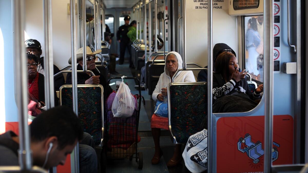 Passengers ride the Metro Blue Line towards Long Beach on January 23. Major portions of the Metro Blue Line will close for eight months starting this weekend, inconveniencing tens of thousands of daily riders.