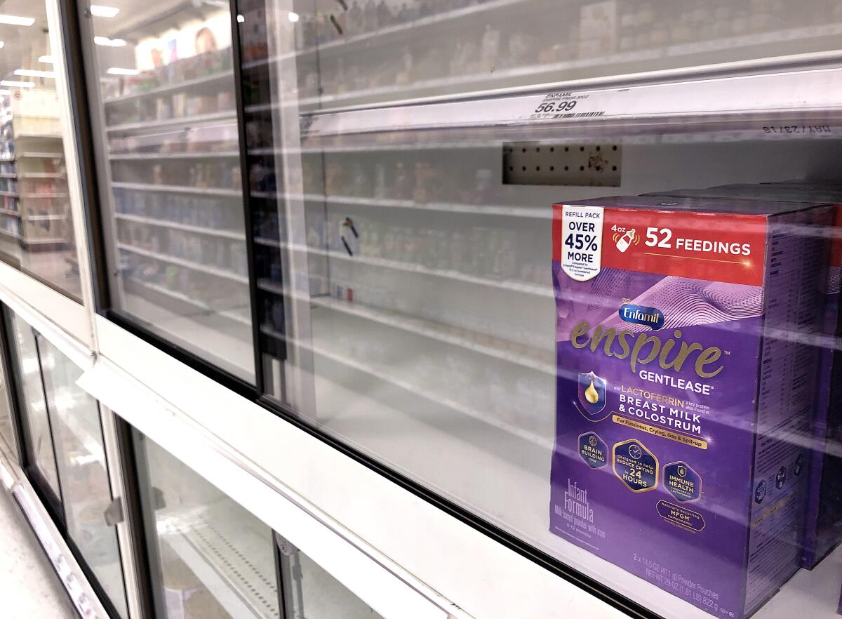 Shelves for baby formula are nearly empty in a Compton store.