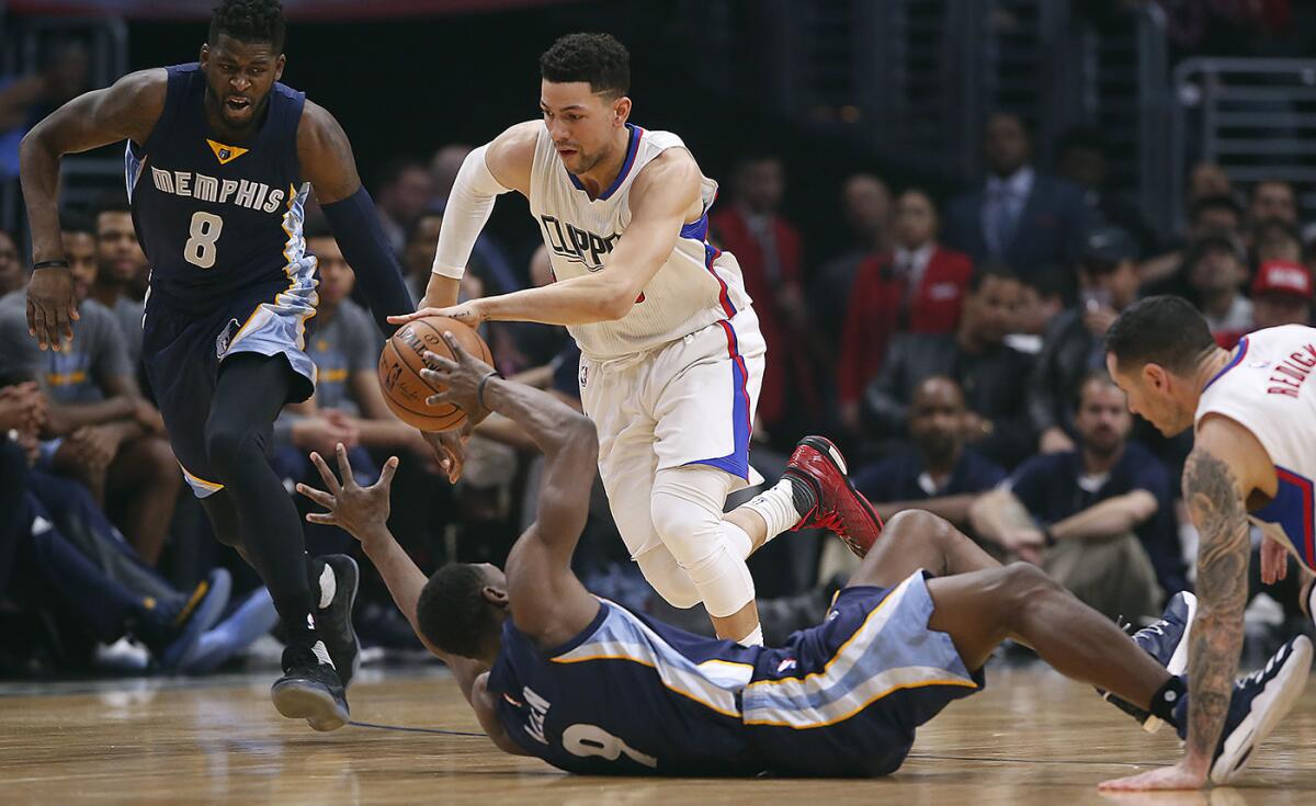 Clippers guard Austin Rivers steals the ball from Memphis Grizzlies guard Tony Allen during first half action at Staples Center.