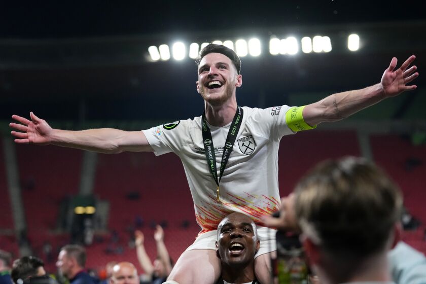 West Ham's Declan Rice celebrates after winning the Europa Conference League final soccer match between Fiorentina and West Ham at the Eden Arena in Prague, Wednesday, June 7, 2023. West Ham won 2-1. (AP Photo/Petr David Josek)