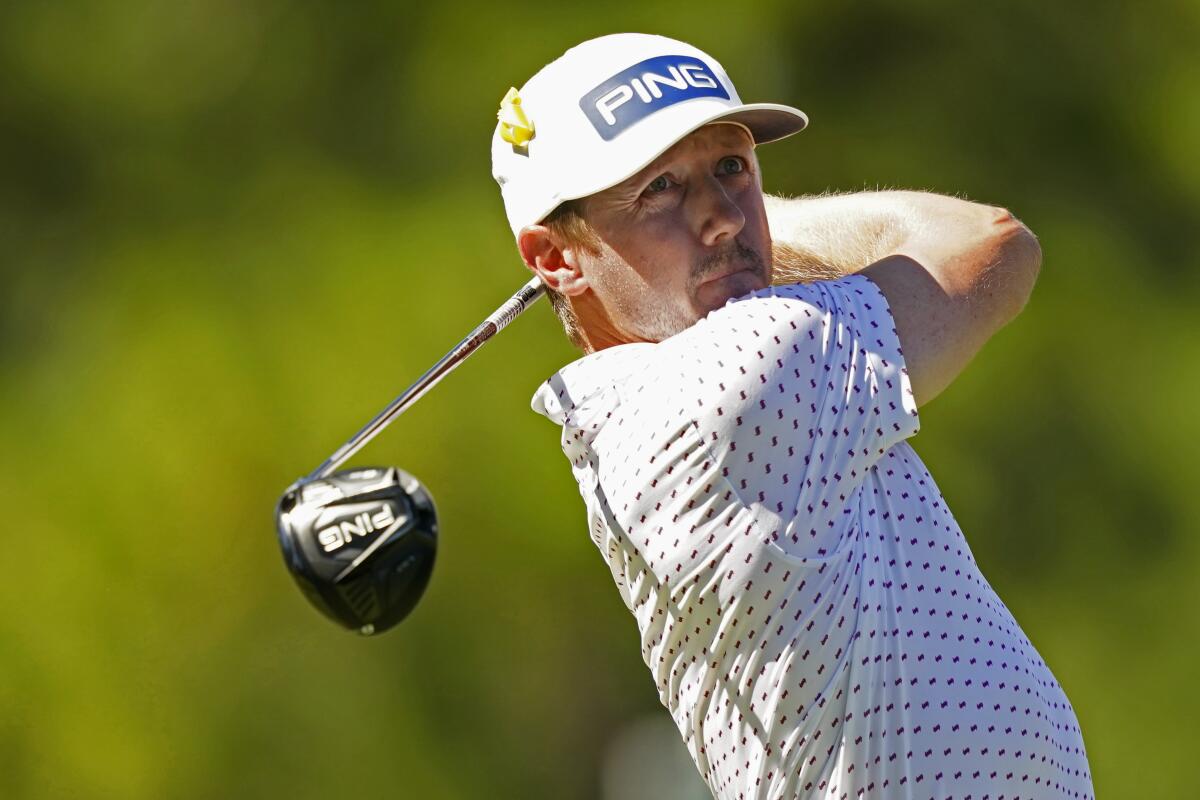 Mackenzie Hughes, of Canada, studies his drive from the second tee during the final day of the Sanderson Farms Championship golf tournament in Jackson, Miss., Sunday, Oct. 2, 2022. (AP Photo/Rogelio V. Solis)